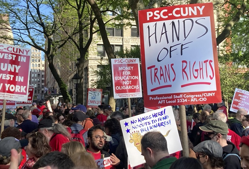 Photo of PCS-CUNY contingent w red signs at NYC May Day 2026 demo.
